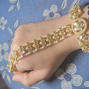 Hand bracelet with ring